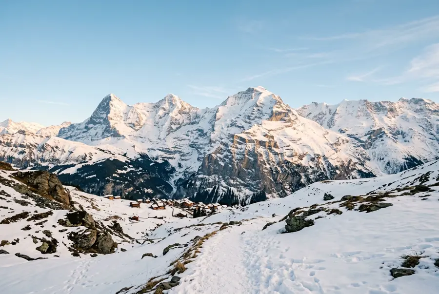 Snow-covered mountain peaks under a clear sky